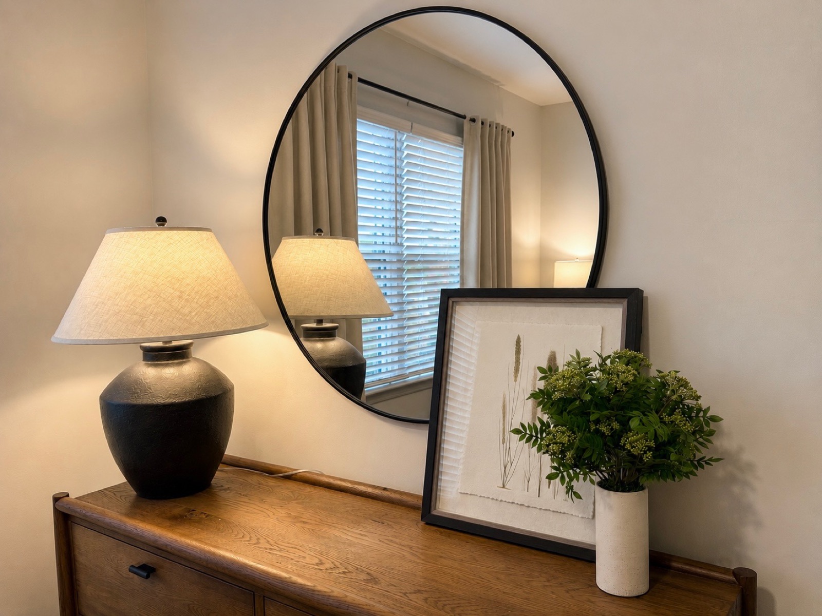 Nexus 45, styled dresser vignette with round mirror